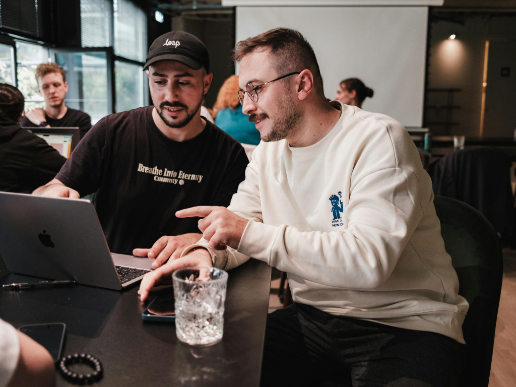 tech bros looking at a laptop