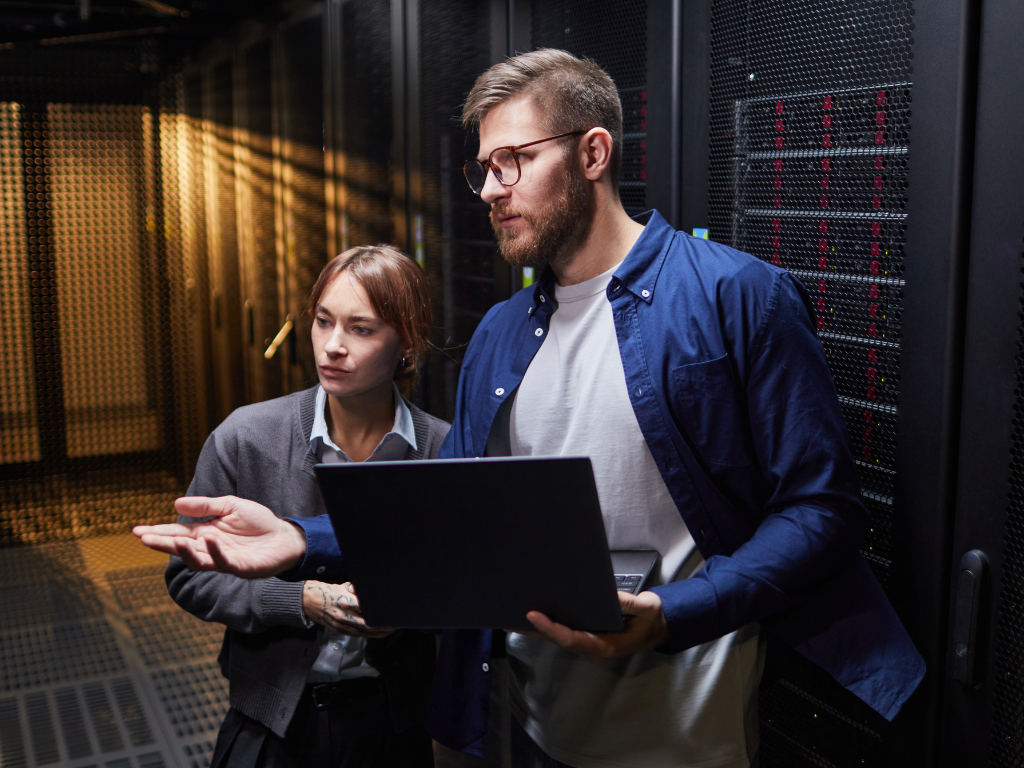 IT professional explaining server setup to another IT professional